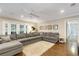 Bright living room showcases hardwood floors, recessed lighting, and a comfortable sectional at 6819 Broken Arrow S Trl, Lakeland, FL 33813
