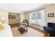 Comfortable living room with a large window and views to the front entry at 6819 Broken Arrow S Trl, Lakeland, FL 33813