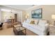 Cozy living room with a comfortable sofa, decorative painting, and open access to the dining room at 6819 Broken Arrow S Trl, Lakeland, FL 33813