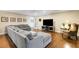 Spacious living room with comfortable seating, hardwood floors, and ample natural light at 6819 Broken Arrow S Trl, Lakeland, FL 33813