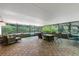 Spacious screened patio with tile flooring, outdoor furniture, offering a relaxed space with views of the pool at 6819 Broken Arrow S Trl, Lakeland, FL 33813