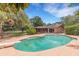 Backyard pool with patio and lounge chairs at 6819 Broken Arrow S Trl, Lakeland, FL 33813