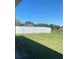 A spacious backyard featuring a lawn and privacy fence, ideal for outdoor activities at 8159 Woodvine Cir, Lakeland, FL 33810