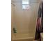 View of bathroom showing shower with a showerhead and window and decorative shower curtain at 8159 Woodvine Cir, Lakeland, FL 33810