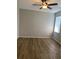This bedroom features a ceiling fan and neutral walls at 8159 Woodvine Cir, Lakeland, FL 33810