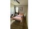 This bedroom has a window, closet, and a TV at 8159 Woodvine Cir, Lakeland, FL 33810
