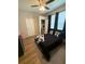 Bedroom with wood-look flooring, closet and ceiling fan with overhead lighting at 8159 Woodvine Cir, Lakeland, FL 33810