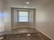 Dining area featuring bright window for natural light and a granite countertop bar at 8159 Woodvine Cir, Lakeland, FL 33810