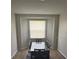 Dining room showcasing a window for natural light and gray accent rug at 8159 Woodvine Cir, Lakeland, FL 33810