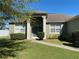 Attractive home featuring a covered entryway and meticulously landscaped front yard at 8159 Woodvine Cir, Lakeland, FL 33810
