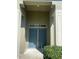 Welcoming front entrance with double doors and decorative pillars at 8159 Woodvine Cir, Lakeland, FL 33810