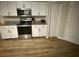 Well-lit kitchen showcasing sleek stainless steel appliances and ample cabinet space at 8159 Woodvine Cir, Lakeland, FL 33810