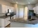 Stylish kitchen with granite countertops, stainless steel appliances, and plenty of cabinetry at 8159 Woodvine Cir, Lakeland, FL 33810
