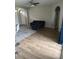 Inviting living area with wood-look flooring and an area rug at 8159 Woodvine Cir, Lakeland, FL 33810