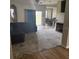 Open-concept living room with a dining area and fireplace at 8159 Woodvine Cir, Lakeland, FL 33810
