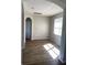 Bright room with wood-look floors and a window for natural light at 8159 Woodvine Cir, Lakeland, FL 33810
