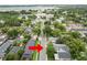 Birds-eye view of the property in a residential neighborhood near a lake at 817 College Ave, Lakeland, FL 33801
