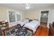 Charming bedroom with hardwood floors, two twin beds, and natural light from a large window at 817 College Ave, Lakeland, FL 33801