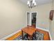Small dining area featuring a wooden table and view to adjacent rooms at 817 College Ave, Lakeland, FL 33801