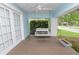 Relaxing front porch with a comfortable swing and views at 817 College Ave, Lakeland, FL 33801