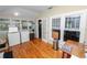 Functional laundry room with hardwood floors and white appliances, offering both practicality and style at 817 College Ave, Lakeland, FL 33801