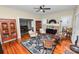 Inviting living room with hardwood floors, fireplace, and area rug at 817 College Ave, Lakeland, FL 33801