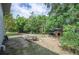 Backyard featuring a picnic table, swing set, and playhouse perfect for Gathering fun and outdoor activities at 818 Woodward St, Lakeland, FL 33803