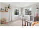 Inviting bedroom with large windows and a comfortable chair with neutral walls at 818 Woodward St, Lakeland, FL 33803