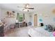 Bright bedroom featuring decor shelving, natural light and comfortable furnishings at 818 Woodward St, Lakeland, FL 33803