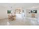 Spacious dining area with tile floors, decorative shelving, and ample natural light, ideal for gatherings at 818 Woodward St, Lakeland, FL 33803