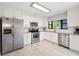 Stylish kitchen with white cabinets, stainless steel appliances, and granite countertops, a culinary delight at 818 Woodward St, Lakeland, FL 33803