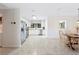 Bright kitchen with stainless steel appliances, white cabinets, and tile flooring, providing a clean aesthetic at 818 Woodward St, Lakeland, FL 33803