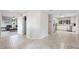 Spacious open-concept living space with a view into the living room and a tiled floor at 818 Woodward St, Lakeland, FL 33803