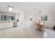 Open-concept kitchen and dining area featuring tile floors, offering a stylish entertaining space at 818 Woodward St, Lakeland, FL 33803