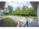 The side of the home features an expansive driveway and manicured landscaping at 818 Woodward St, Lakeland, FL 33803
