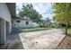 The side of the home features an expansive driveway and manicured landscaping at 818 Woodward St, Lakeland, FL 33803
