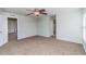 Comfortable bedroom with ceiling fan and neutral walls, providing a serene space for rest at 8323 Greystone Dr, Lakeland, FL 33810