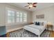 Stylish bedroom features shuttered windows, hardwood floors, and modern decor at 838 S Tennessee Ave, Lakeland, FL 33801