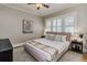 Bright bedroom featuring shuttered windows, cozy decor and warm lighting at 838 S Tennessee Ave, Lakeland, FL 33801
