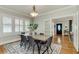 Elegant dining room with large windows, modern lighting, and an open floor plan at 838 S Tennessee Ave, Lakeland, FL 33801