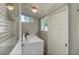 Functional laundry room with a washer and dryer, storage space, and natural light at 838 S Tennessee Ave, Lakeland, FL 33801