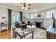 Cozy living room featuring a fireplace, built-in shelving, and natural light at 838 S Tennessee Ave, Lakeland, FL 33801