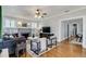 Spacious living room featuring hardwood floors, a fireplace, and ample seating at 838 S Tennessee Ave, Lakeland, FL 33801