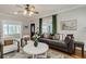 Comfortable living room with a large sofa, stylish decor, and hardwood floors at 838 S Tennessee Ave, Lakeland, FL 33801