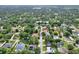 Aerial view of house showcasing neighborhood, mature trees, and landscaping at 1145 Denton St, Lakeland, FL 33803