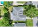 Aerial view of house showcasing the backyard, mature trees, and landscaping at 1145 Denton St, Lakeland, FL 33803