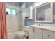Well-lit bathroom features a shower-tub combo and modern vanity at 1145 Denton St, Lakeland, FL 33803