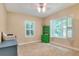 Tan bedroom featuring built-in cabinets and a window with shutters at 1145 Denton St, Lakeland, FL 33803