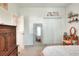 Large bedroom with carpet flooring, closet, and vintage dressing table at 1145 Denton St, Lakeland, FL 33803