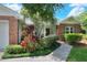 The front exterior features brick accents, a well-manicured lawn, and a welcoming walkway at 1145 Denton St, Lakeland, FL 33803